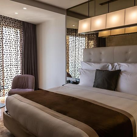 Hotel Lancaster Plaza Beyrouth Extérieur photo A bedroom at the hotel